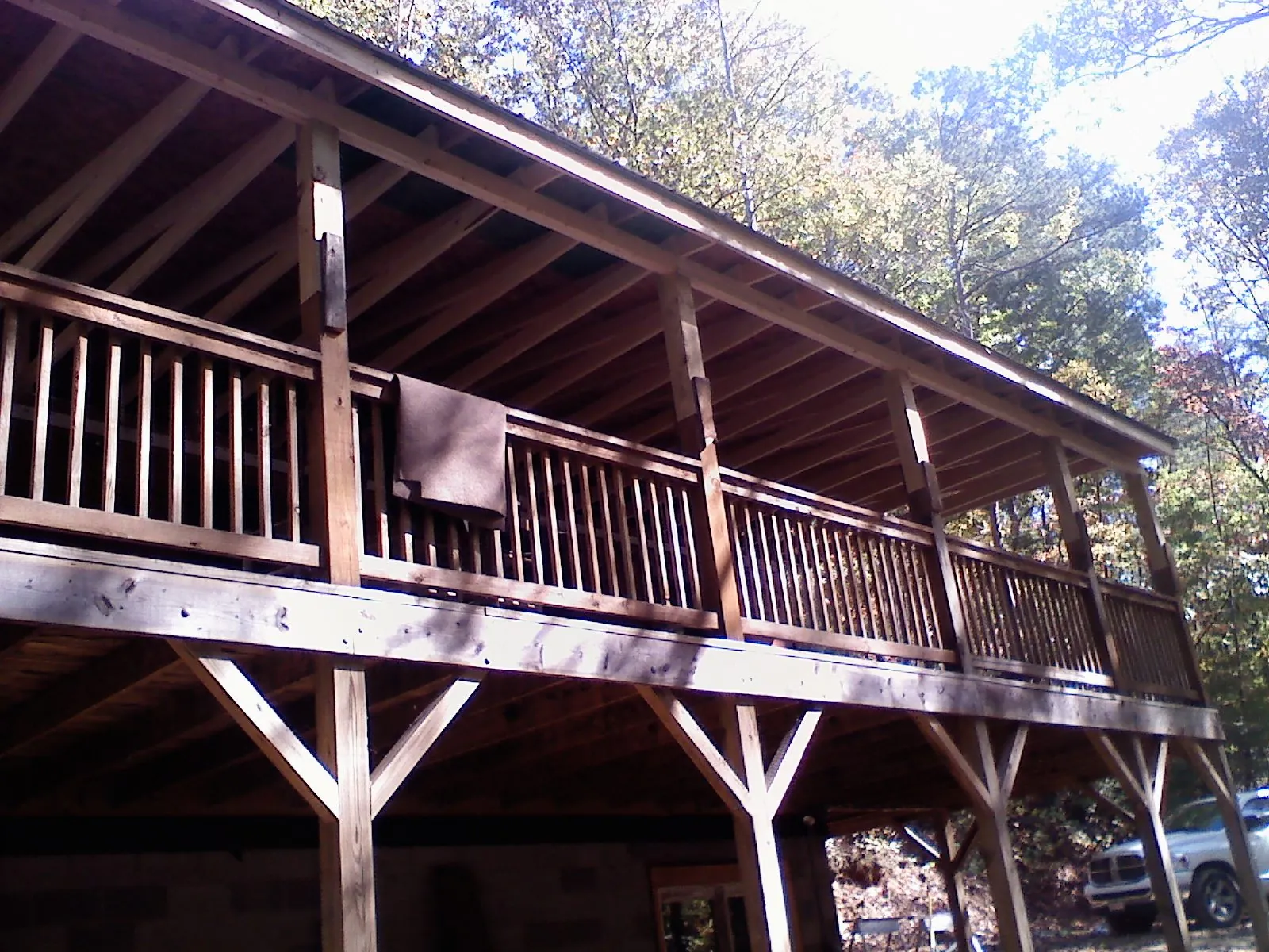 Timber framing under a new elevated porch and deck — Roof Leak Repair in Woodland Park by Roofing Brothers